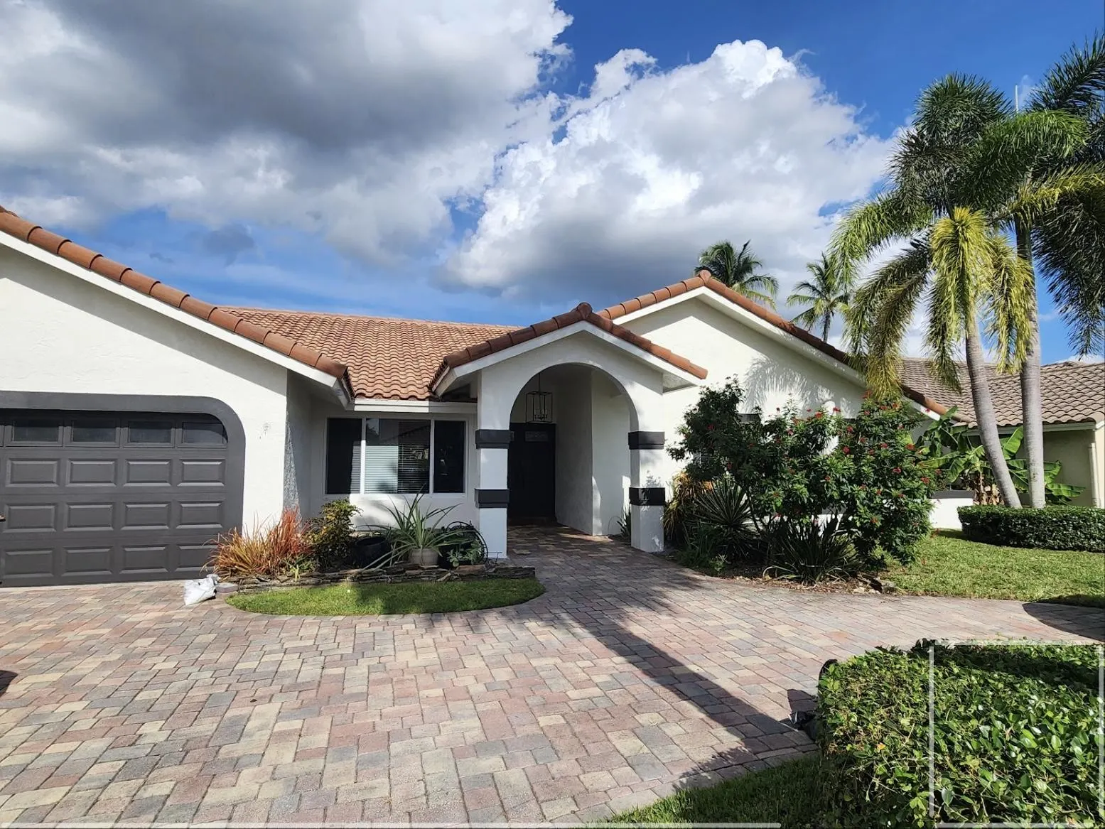 White exterior repaint with terracotta roof