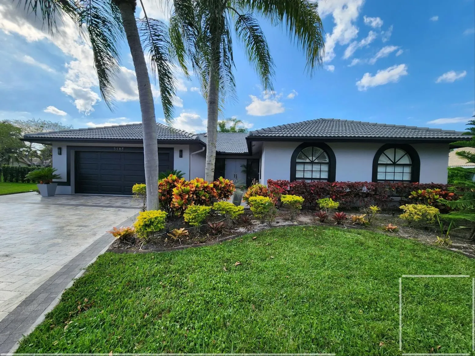 Single-story exterior repaint with fresh landscaping