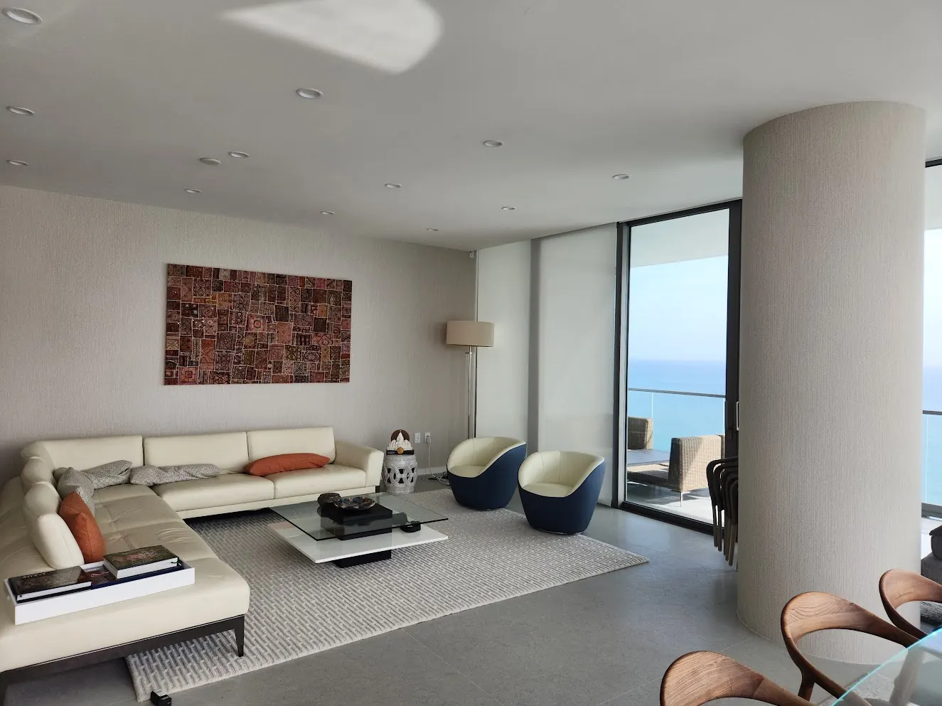 Condominium living room with floor-to-ceiling ocean views after interior painting