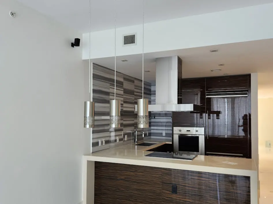 Condominium kitchen with white walls and ceiling after interior painting