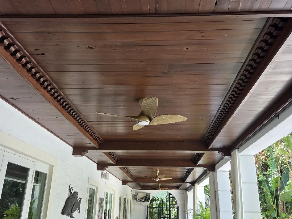 Stained tongue-and-groove wood ceiling over a covered terrace in Miami