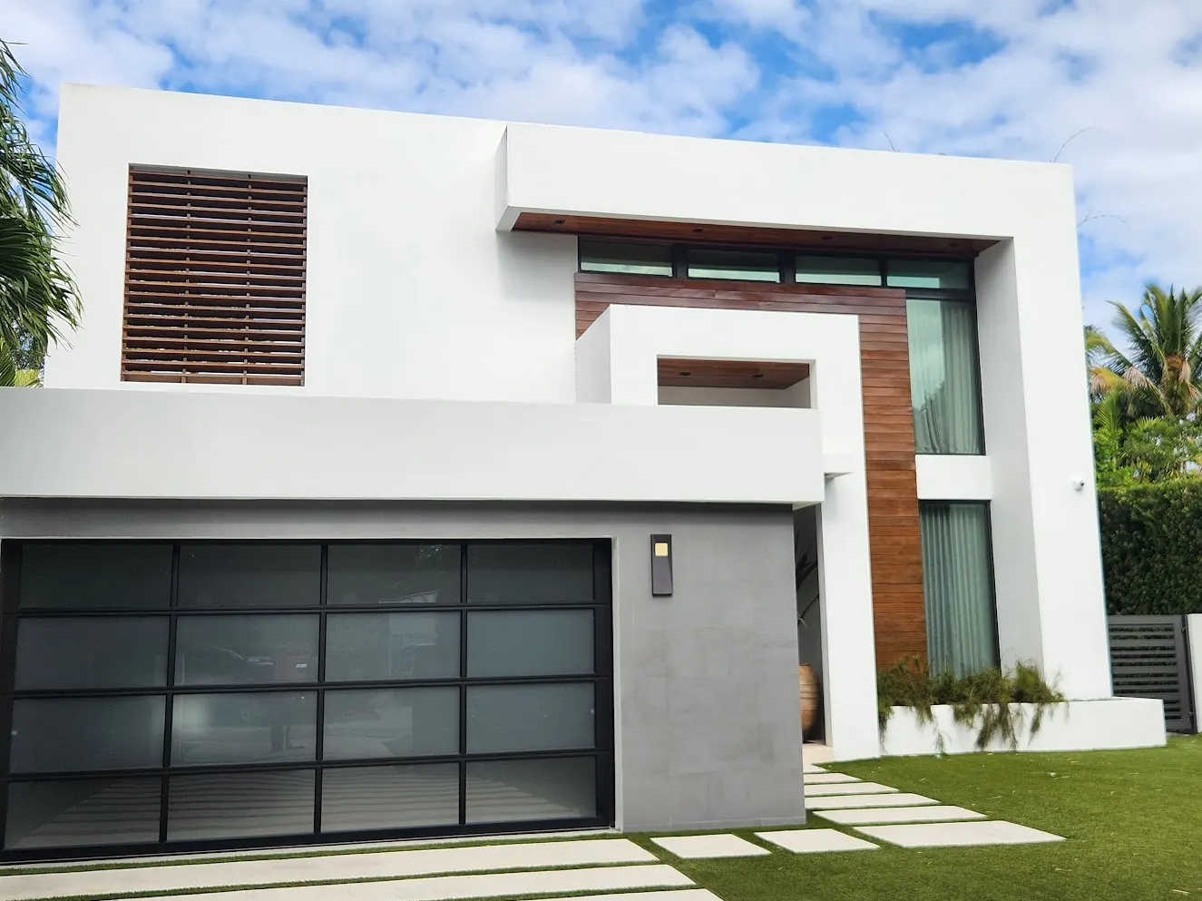 Modern two-story white residence in Miami after an exterior repaint