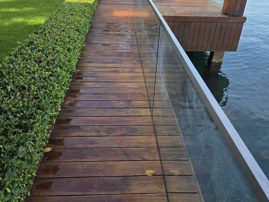 Stained wood dock deck along the water in Miami Beach