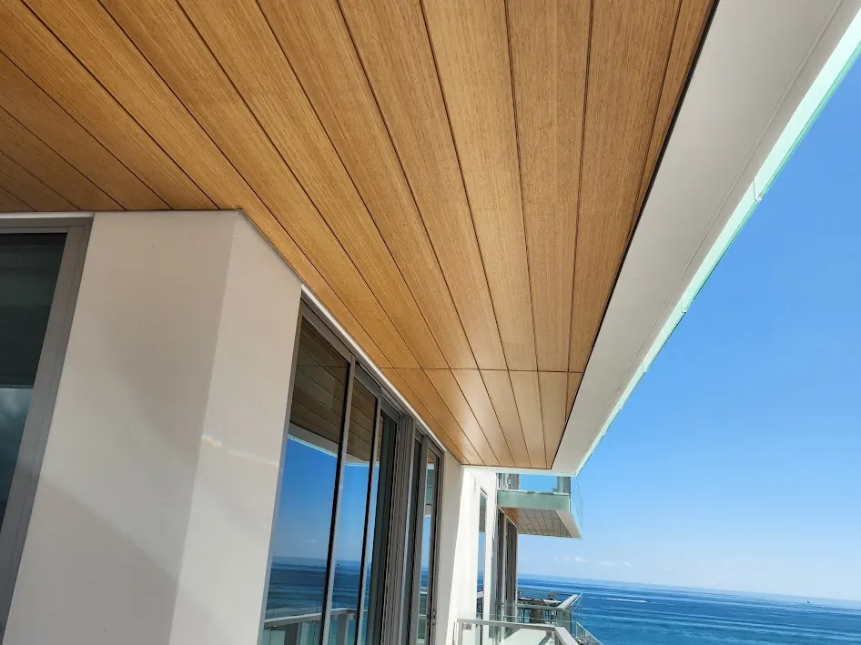 Wood-clad balcony soffit with the ocean beyond