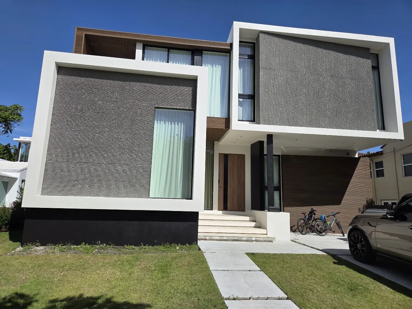 Contemporary Miami Beach residence with textured panels after an exterior repaint