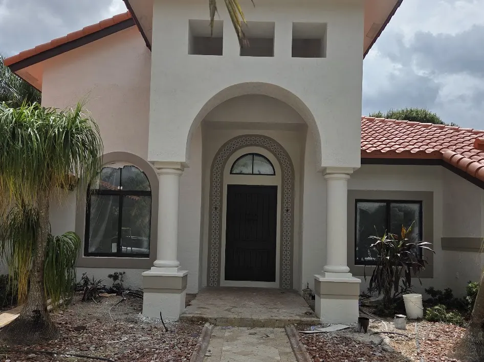 Arched entry of a barrel-tile Weston home after an exterior repaint
