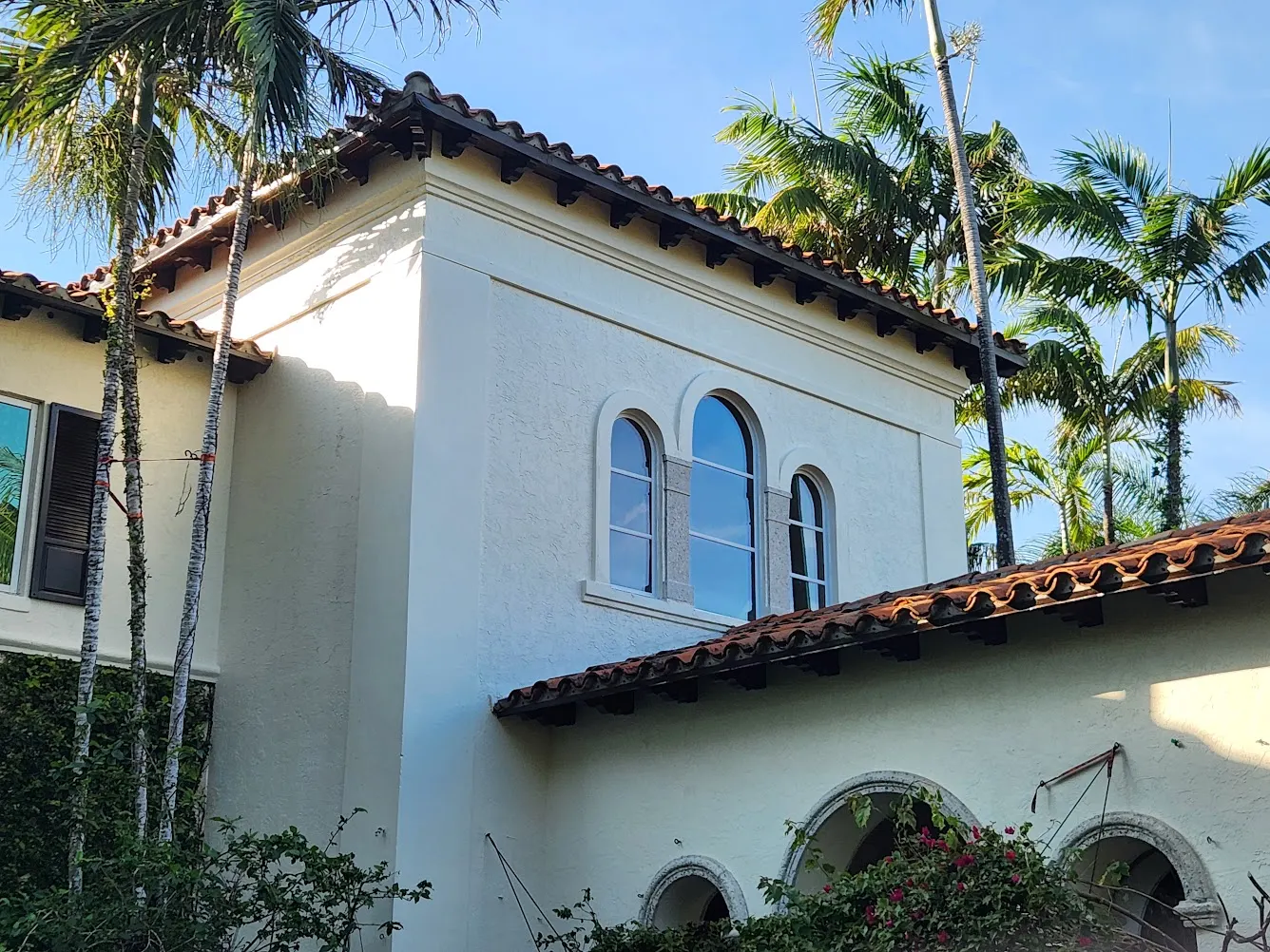 Finished corner elevation with restored eaves and arched windows