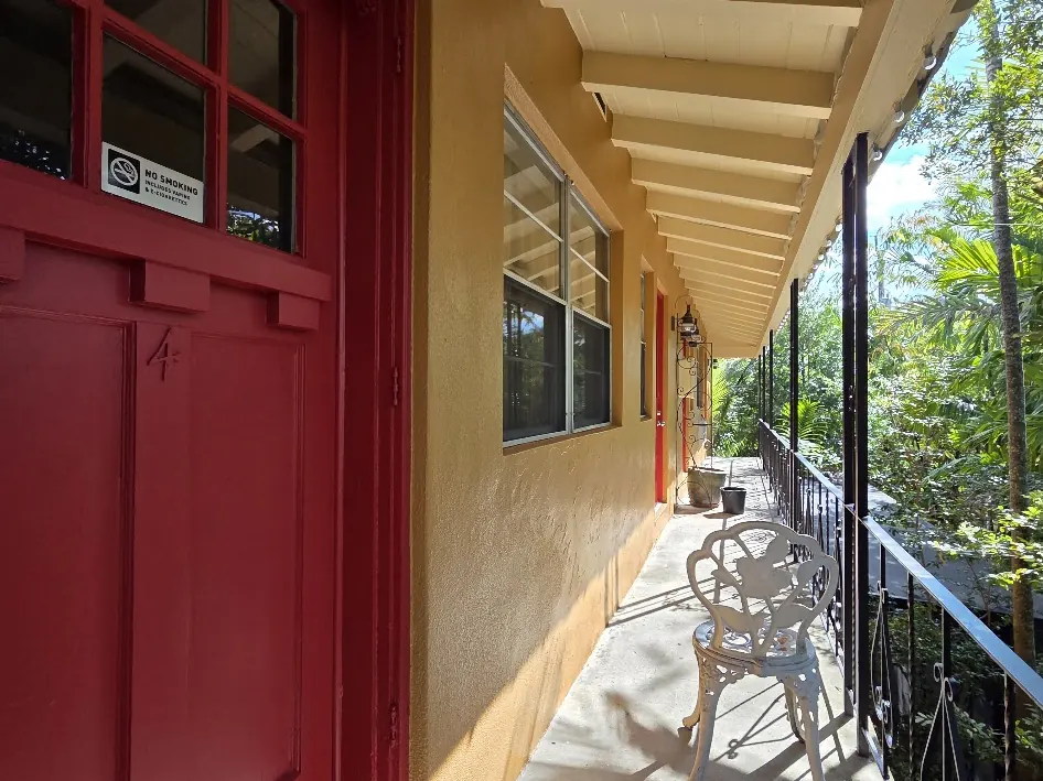 Mary Mac Red door under a Rococo Yellow soffit along the upper walkway