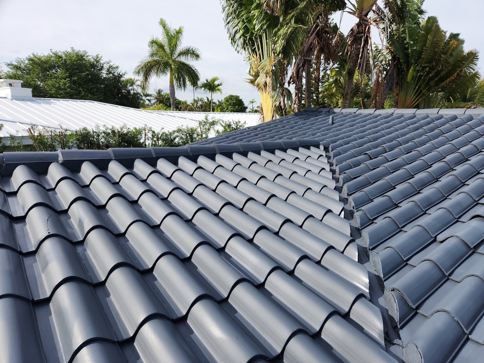 Roof Painting project in Hollywood Florida by Paint 2 Last